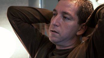 Movie still from “Citizenfour” (2014), directed by Laura Poitras – A person with his hands behind his head; Close Up shot, Low angle