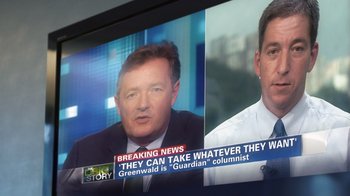 Movie still from “Citizenfour” (2014), directed by Laura Poitras – A television screen showing a news anchor and a news anchor; Close Up shot, Over the shoulder angle