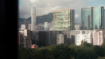 Movie still from “Citizenfour” (2014), directed by Laura Poitras – A view of a city skyline from a distance; Extreme Wide shot, High angle
