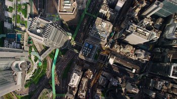 Movie still from “Citizenfour” (2014), directed by Laura Poitras – An aerial view of a large city with lots of buildings; Extreme Wide shot, Overhead angle
