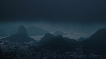 Movie still from “Citizenfour” (2014), directed by Laura Poitras – A view of a city and mountains in the distance; Extreme Wide shot, High angle