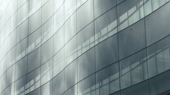Movie still from “Citizenfour” (2014), directed by Laura Poitras – A building that has many windows on it; Extreme Close Up shot, Low angle