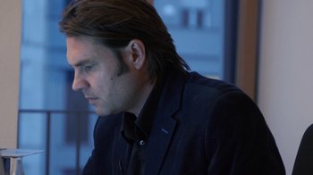 Movie still from “Citizenfour” (2014), directed by Laura Poitras – A person with long hair; Close Up shot, Low angle