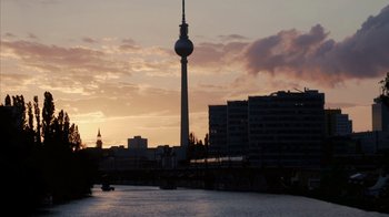 Movie still from “Citizenfour” (2014), directed by Laura Poitras – A view of a city skyline at sunset; Extreme Wide shot, Low angle
