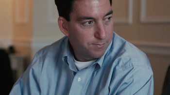 Movie still from “Citizenfour” (2014), directed by Laura Poitras – A person wearing a blue shirt; Close Up shot, Low angle