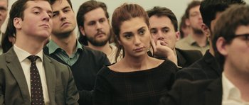 Movie still from “City of Ghosts” (2017), directed by Matthew Heineman – A group of men and a woman standing next to each other; Close Up shot, High angle
