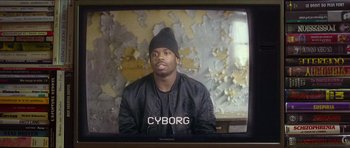 Movie still from “Climax” (2018), directed by Gaspar Noé – A man wearing a black jacket and a black hat; Close Up shot, Low angle