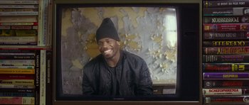 Movie still from “Climax” (2018), directed by Gaspar Noé – A man wearing a black jacket and a black hat; Close Up shot, Over the shoulder angle