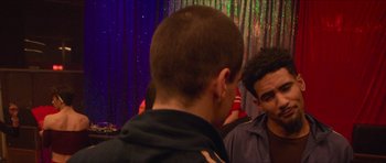 Movie still from “Climax” (2018), directed by Gaspar Noé – Two young men talking to each other at a party; Close Up shot, Over the shoulder angle