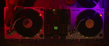 Movie still from “Climax” (2018), directed by Gaspar Noé – A pair of turntables and a mixer; Extreme Close Up shot, Overhead angle