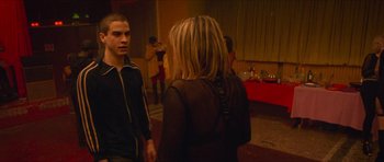 Movie still from “Climax” (2018), directed by Gaspar Noé – A man and a woman talking to each other; Medium shot, Over the shoulder angle