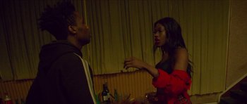 Movie still from “Climax” (2018), directed by Gaspar Noé – A man and a woman are talking in a room; Medium shot, Over the shoulder angle