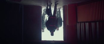 Movie still from “Climax” (2018), directed by Gaspar Noé – A group of people hanging upside down in a room; Wide shot, Low angle