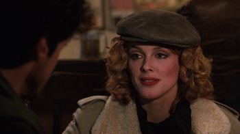 Movie still from “Cobra” (1986), directed by George P. Cosmatos – A person wearing a hat; Close Up shot, Over the shoulder angle