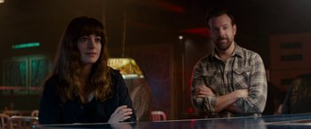 Movie still from “Colossal” (2016), directed by Nacho Vigalondo – A man and a woman sitting at a table; Medium shot, Over the shoulder angle
