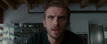 Movie still from “Colossal” (2016), directed by Nacho Vigalondo – A person looking at the camera; Close Up shot, Low angle