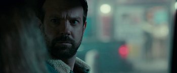 Movie still from “Colossal” (2016), directed by Nacho Vigalondo – A person with a beard; Close Up shot, Over the shoulder angle