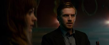 Movie still from “Colossal” (2016), directed by Nacho Vigalondo – A man and a woman in a dark room; Close Up shot, Over the shoulder angle