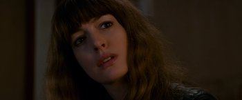 Movie still from “Colossal” (2016), directed by Nacho Vigalondo – A woman's face with long brown hair; Close Up shot, Over the shoulder angle