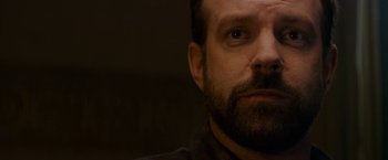 Movie still from “Colossal” (2016), directed by Nacho Vigalondo – A person with a beard; Close Up shot, Low angle