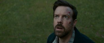 Movie still from “Colossal” (2016), directed by Nacho Vigalondo – A person with a face covered in blood; Close Up shot, High angle