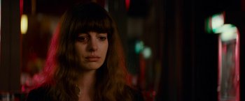 Movie still from “Colossal” (2016), directed by Nacho Vigalondo – A person with long brown hair; Close Up shot, Over the shoulder angle