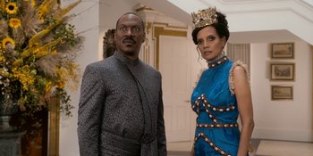 Movie still from “Coming 2 America” (2021), directed by Craig Brewer – A man and a woman dressed in formal wear; Medium shot, Low angle