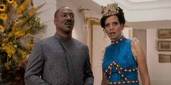 Movie still from “Coming 2 America” (2021), directed by Craig Brewer – A man and a woman standing next to each other; Medium shot, Over the shoulder angle