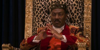Movie still from “Coming 2 America” (2021), directed by Craig Brewer – A man wearing a red robe and a gold crown; Close Up shot, Low angle