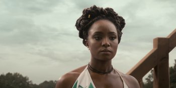 Movie still from “Coming 2 America” (2021), directed by Craig Brewer – A person wearing a necklace; Close Up shot, Low angle