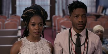 Movie still from “Coming 2 America” (2021), directed by Craig Brewer – A man and a woman standing next to each other; Close Up shot, Over the shoulder angle