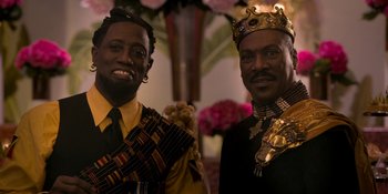 Movie still from “Coming 2 America” (2021), directed by Craig Brewer – A couple of men standing next to each other; Close Up shot, Low angle