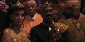 Movie still from “Coming 2 America” (2021), directed by Craig Brewer – A group of men and women in a crowd; Close Up shot, Over the shoulder angle