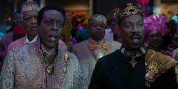 Movie still from “Coming 2 America” (2021), directed by Craig Brewer – A group of men standing next to each other wearing crowns; Close Up shot, Low angle
