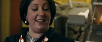 Movie still from “Compliance” (2012), directed by Craig Zobel – A person with a tie; Close Up shot, Over the shoulder angle