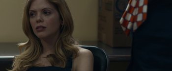 Movie still from “Compliance” (2012), directed by Craig Zobel – A person sitting in a chair; Close Up shot, Over the shoulder angle