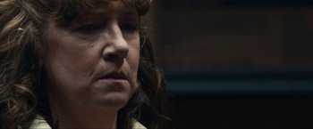 Movie still from “Compliance” (2012), directed by Craig Zobel – A person with long hair; Close Up shot, Over the shoulder angle