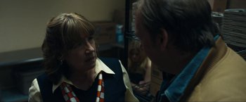 Movie still from “Compliance” (2012), directed by Craig Zobel – A woman and a man talking to each other; Close Up shot, Over the shoulder angle