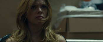 Movie still from “Compliance” (2012), directed by Craig Zobel – A person with long blonde hair; Close Up shot, Low angle