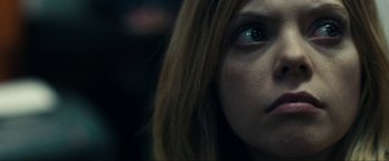 Movie still from “Compliance” (2012), directed by Craig Zobel – A woman's eyes and hair; Close Up shot, Over the shoulder angle