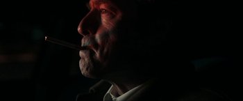 Movie still from “Compliance” (2012), directed by Craig Zobel – A person smoking a cigarette; Close Up shot, Low angle