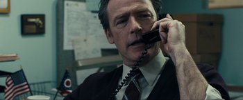 Movie still from “Compliance” (2012), directed by Craig Zobel – A person talking on a phone; Close Up shot, Low angle