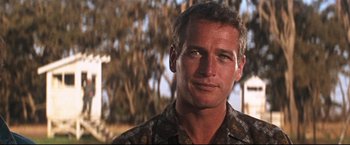 Movie still from “Cool Hand Luke” (1967), directed by Stuart Rosenberg – A person wearing a camouflage shirt; Close Up shot, Low angle