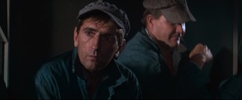 Movie still from “Cool Hand Luke” (1967), directed by Stuart Rosenberg – A man wearing a hat is looking at the camera; Close Up shot, Low angle