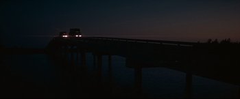 Movie still from “Cool Hand Luke” (1967), directed by Stuart Rosenberg – A truck driving on a bridge at night; Extreme Wide shot, Low angle