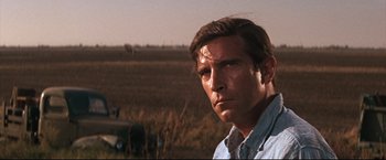 Movie still from “Cool Hand Luke” (1967), directed by Stuart Rosenberg – A person in a field; Close Up shot, Low angle