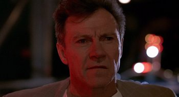 Movie still from “Cop Land” (1997), directed by James Mangold – A person wearing a jacket; Close Up shot, Low angle