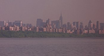 Movie still from “Cop Land” (1997), directed by James Mangold – A view of a large city from across the water; Extreme Wide shot, High angle
