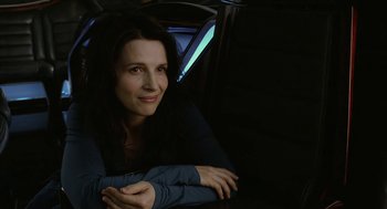 Movie still from “Cosmopolis” (2012), directed by David Cronenberg – A woman sitting in the back seat of a car; Close Up shot, Over the shoulder angle