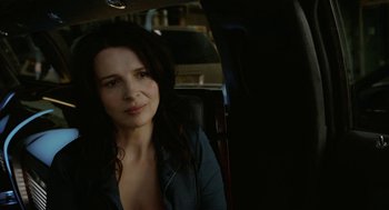 Movie still from “Cosmopolis” (2012), directed by David Cronenberg – A woman sitting in the back seat of a car; Close Up shot, Over the shoulder angle